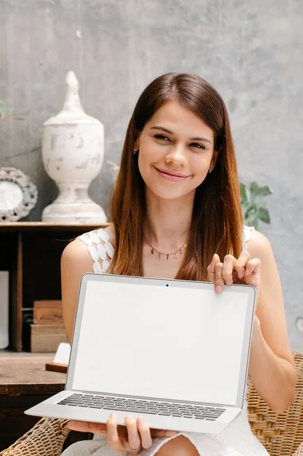 A person using a laptop to browse stock photo websites. Freelancing work in a cozy setting.